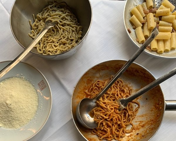 oman Christmas table with amatriciana pasta, Cheese and cacio e pepe